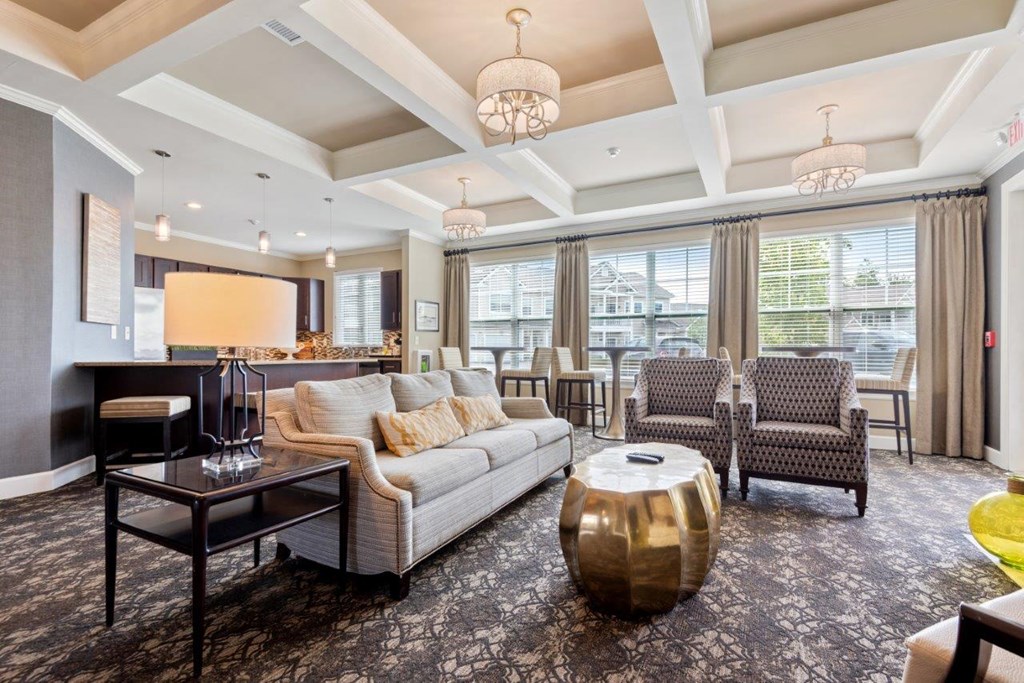 a living room with couches and chairs and a table