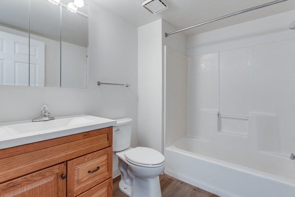 a bathroom with a sink toilet and a shower