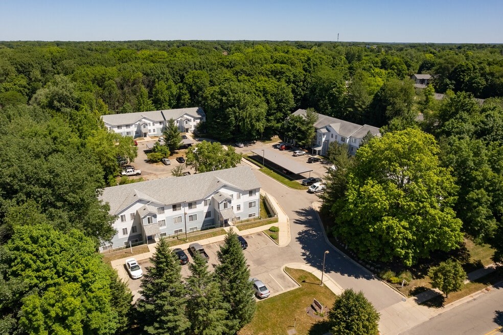 an aerial view of a neighborhood with houses and trees