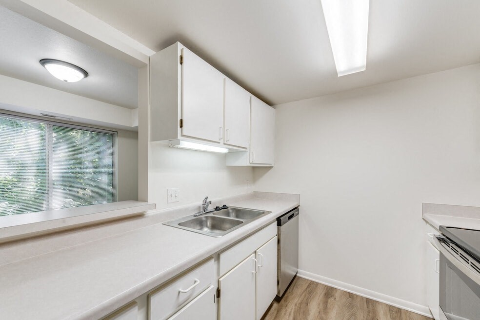 the preserve at ballantyne commons apartment kitchen with sink and stove and window