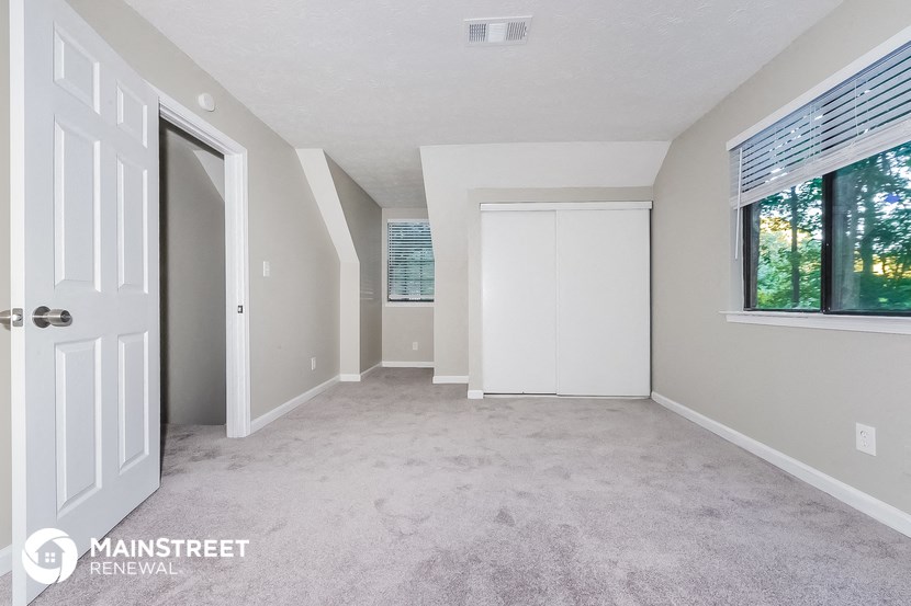 the master bedroom is spacious and has a large window