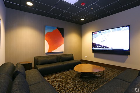 a living room with couches and a tv