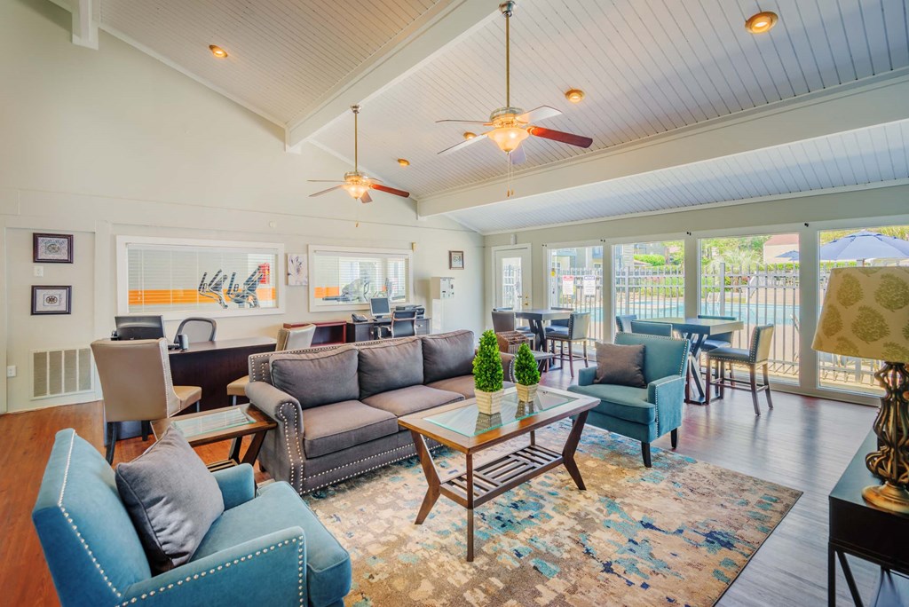a living room with couches and chairs