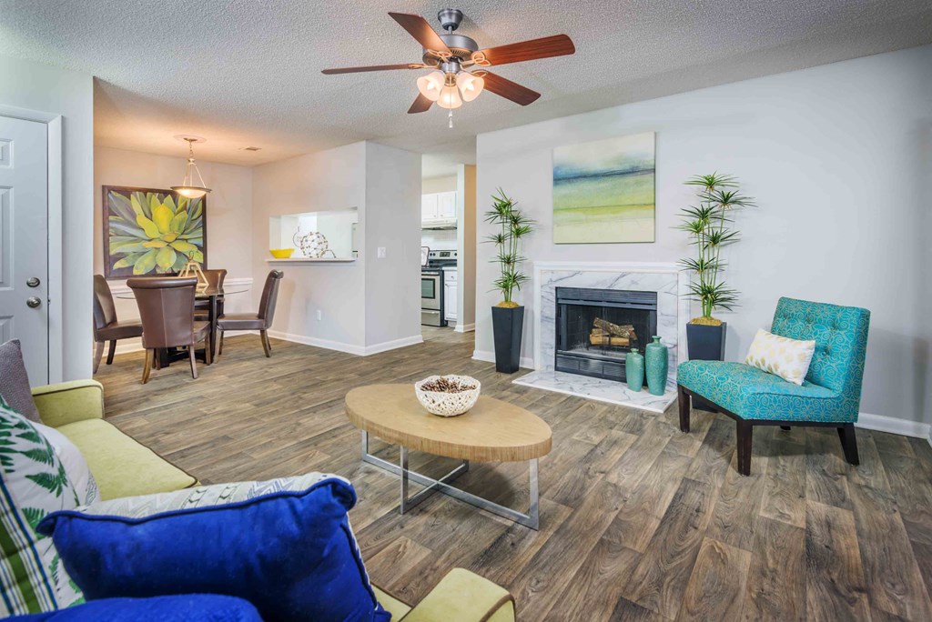 a living room with a fireplace and a table