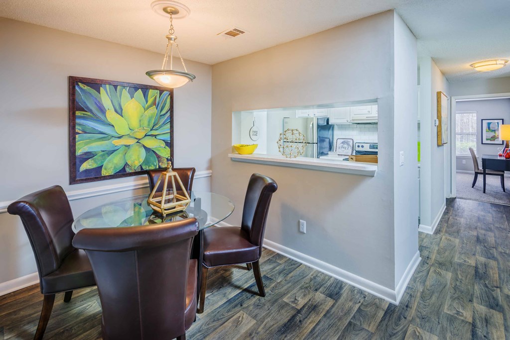 a dining room with a table and chairs