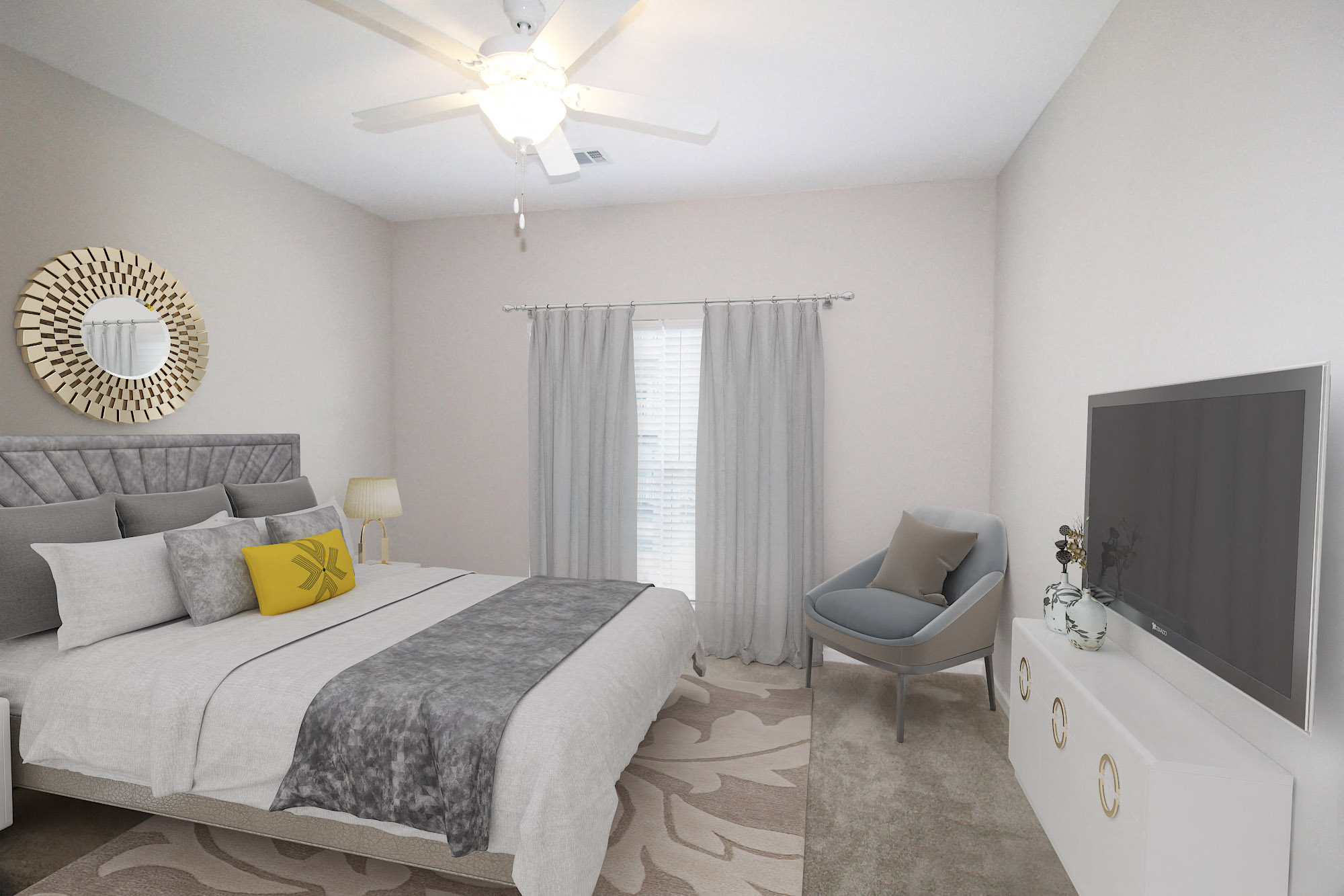 a bedroom with a large bed and a ceiling fan