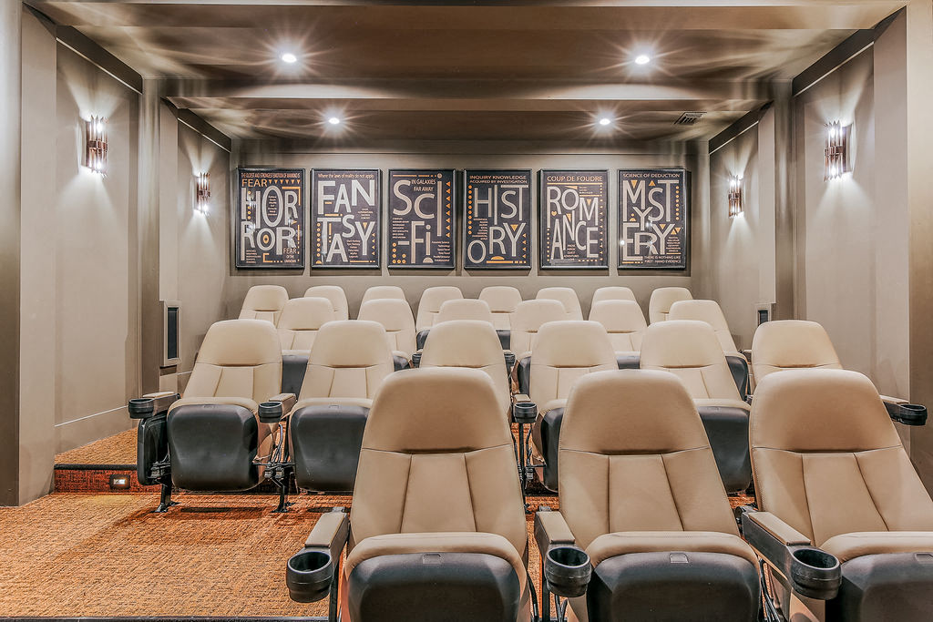 a large auditorium filled with chairs and a wall of graffiti