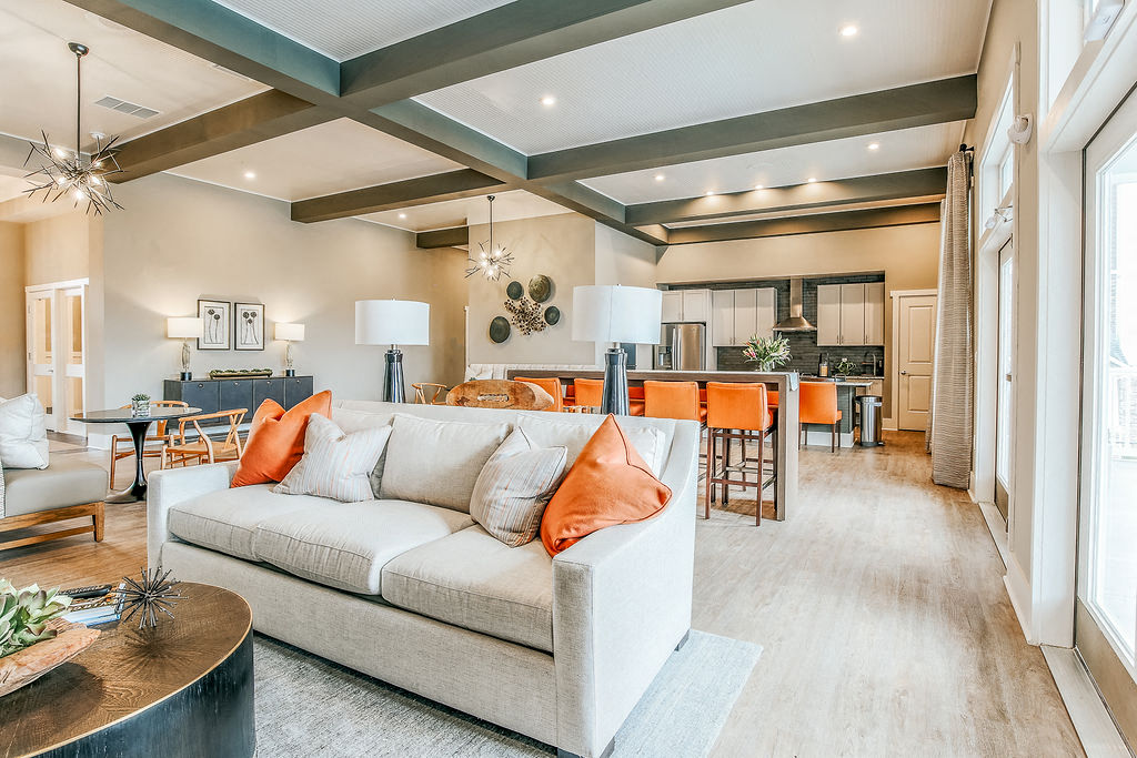 a living room and dining room with a couch and a table