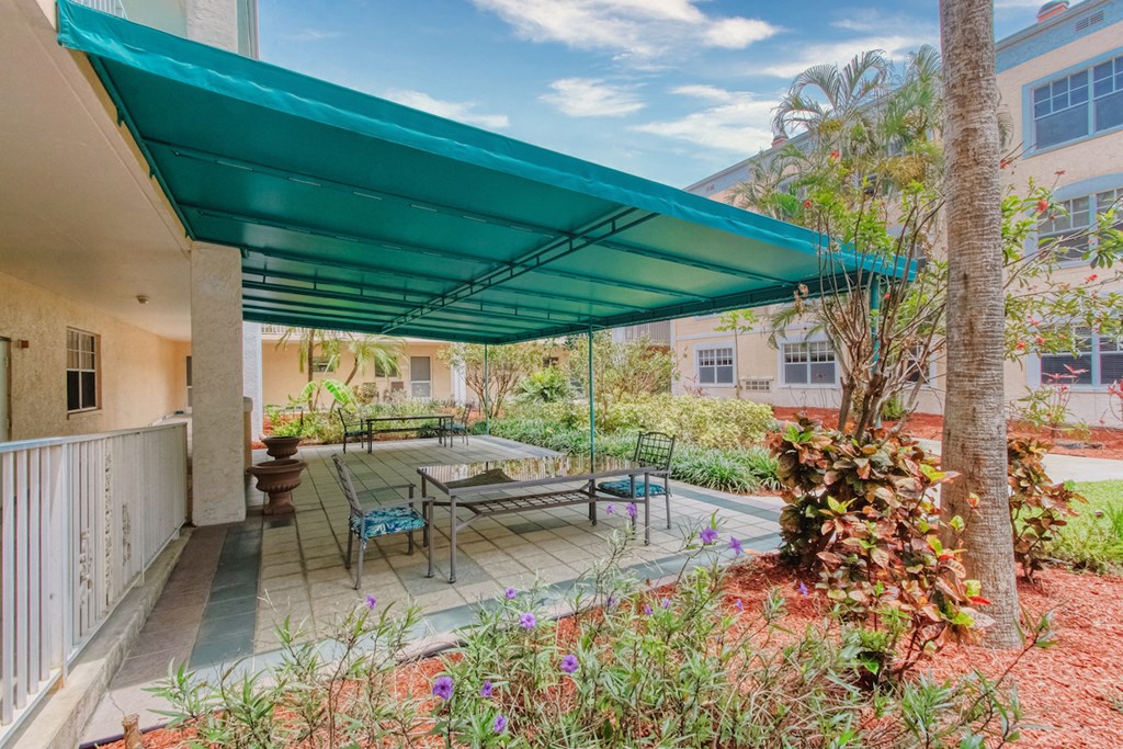 Covered patio with tables and chairs