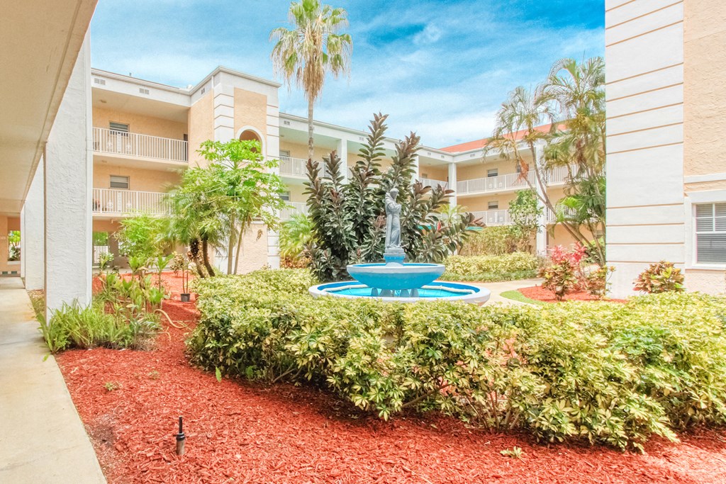 Courtyard with neat mulching, landscaping and fountain