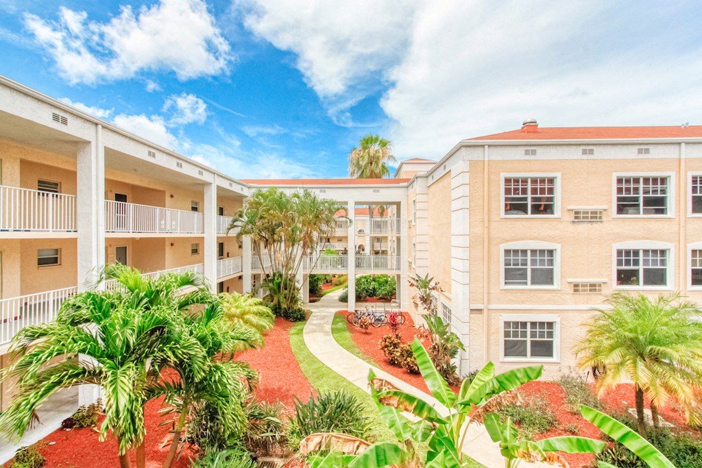 Lushly landscaped courtyard with walking path