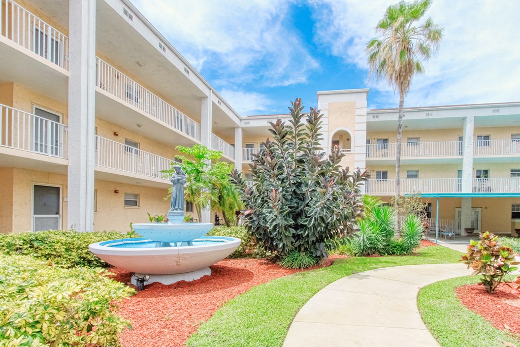 Fountain beside walking path in large courtyard