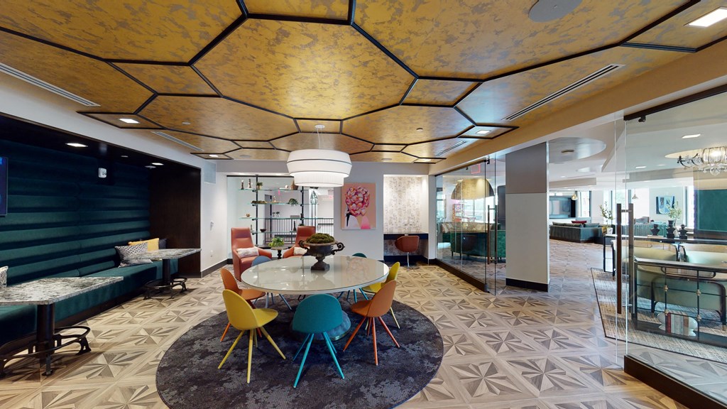 a dining room with colorful chairs and a table