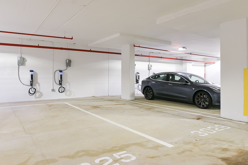 a parking garage with a car parked in it