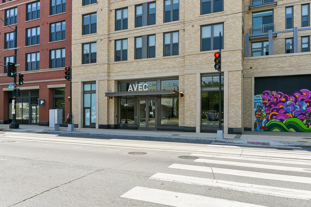 a building on the corner of a street with a traffic light