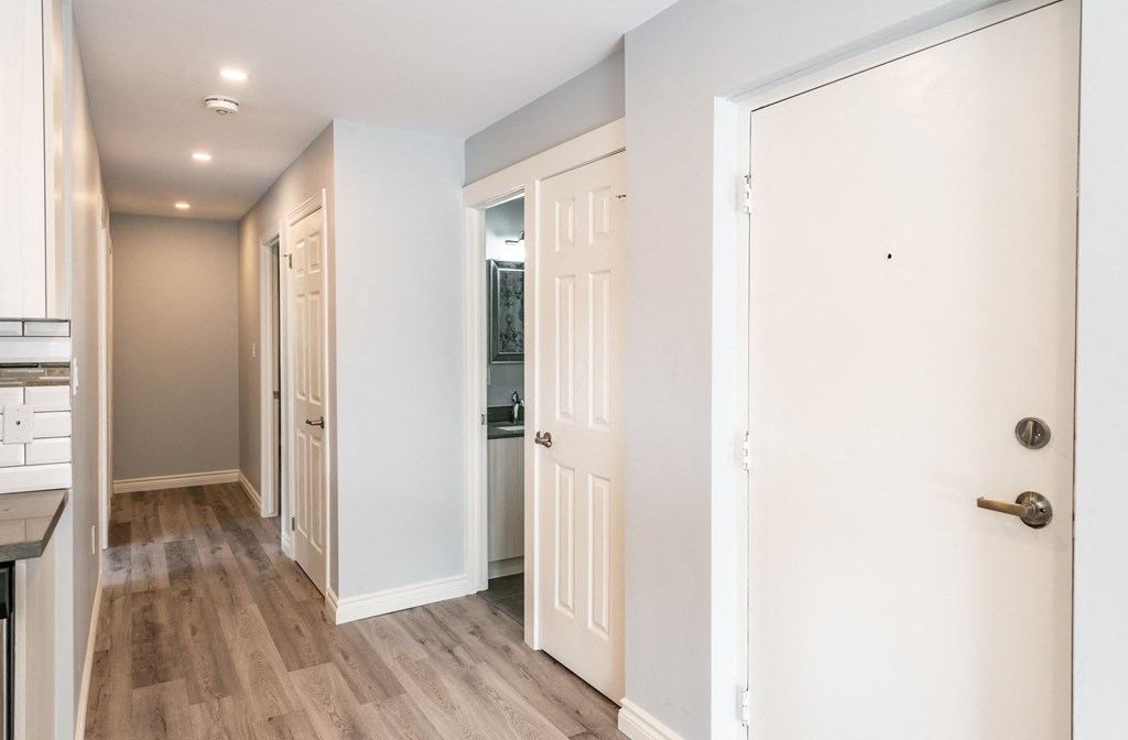 a renovated living room and hallway in a new home
