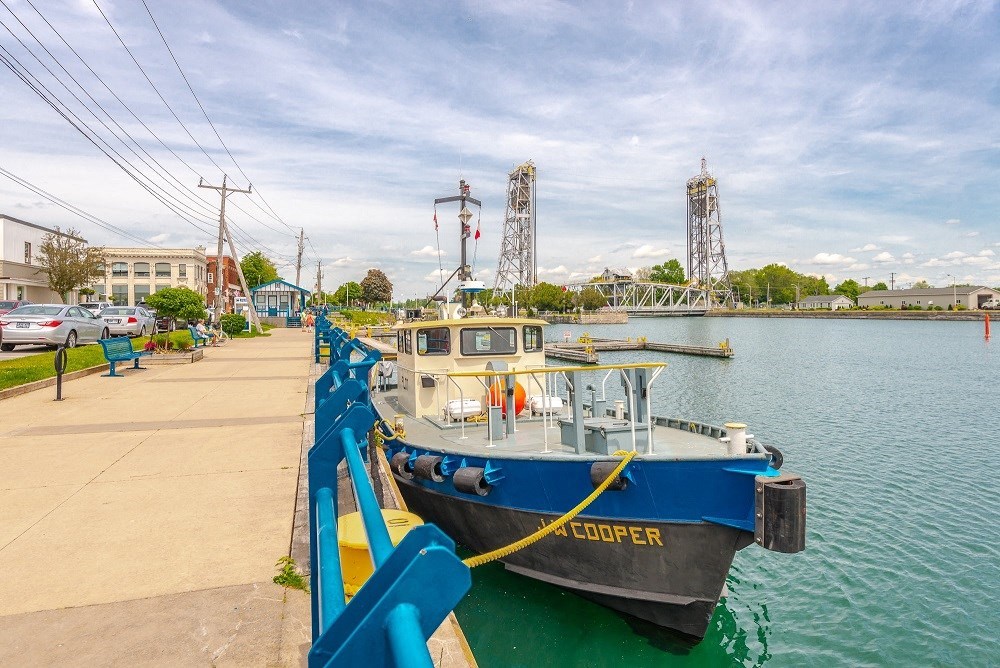 a boat is docked at a dock on the water
