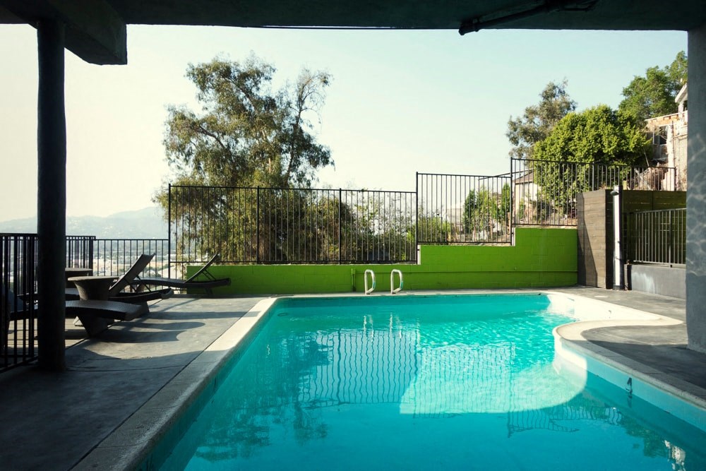 the pool is heated and has a view of the ocean