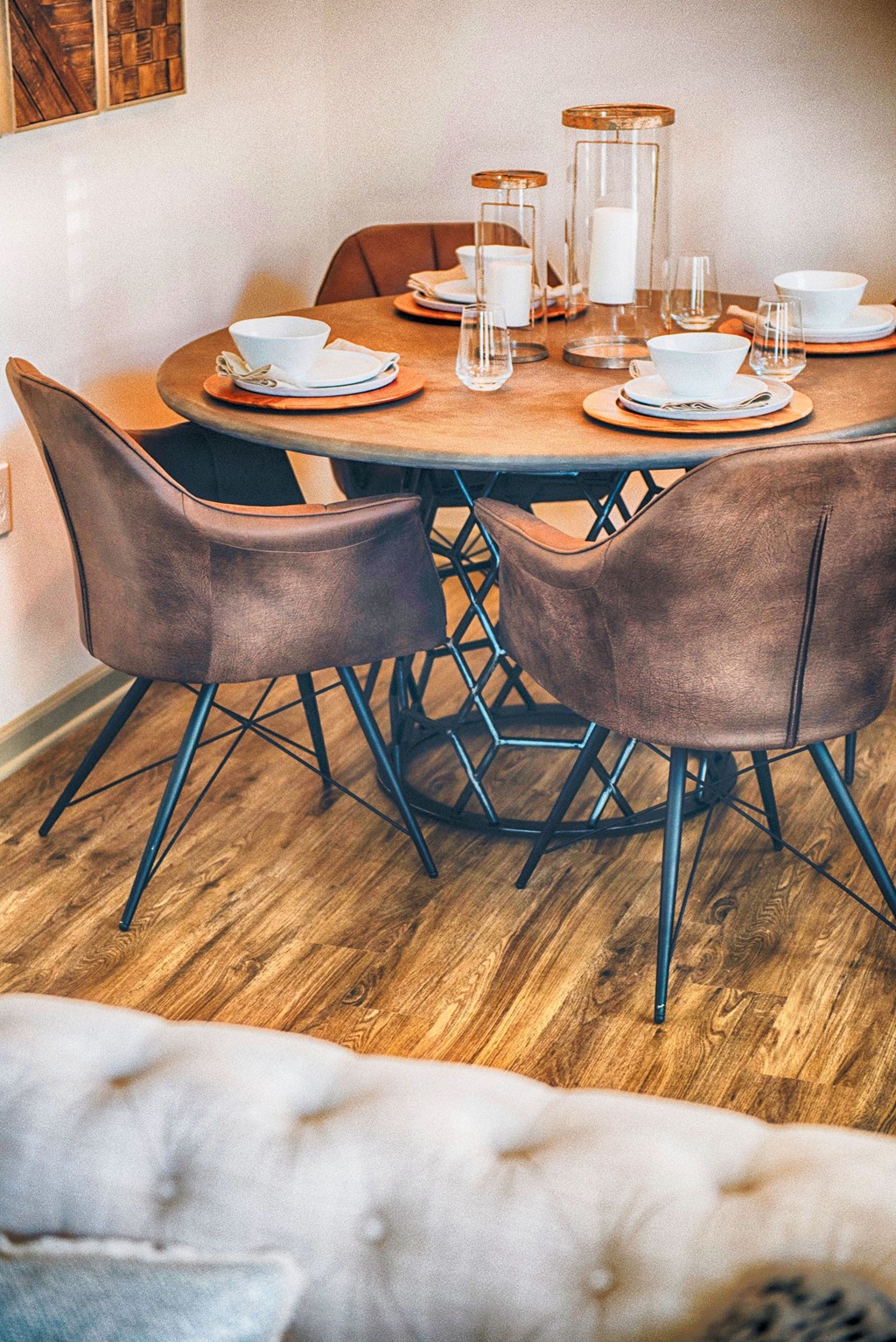 a dining room with a wooden table and chairs