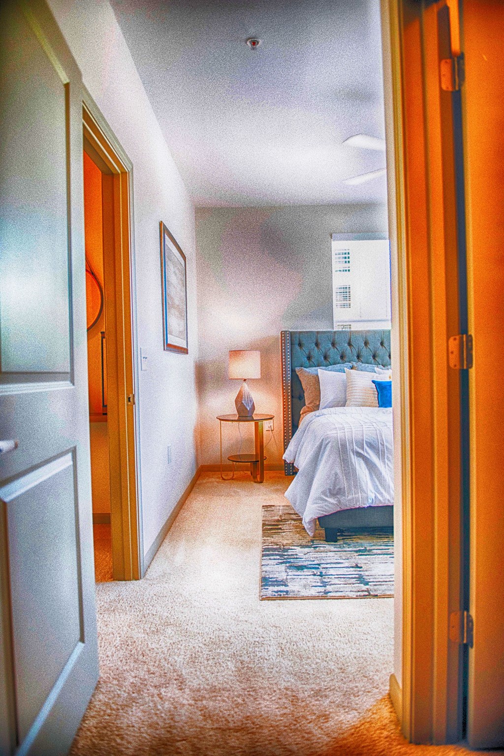 a bedroom with a bed and an open door