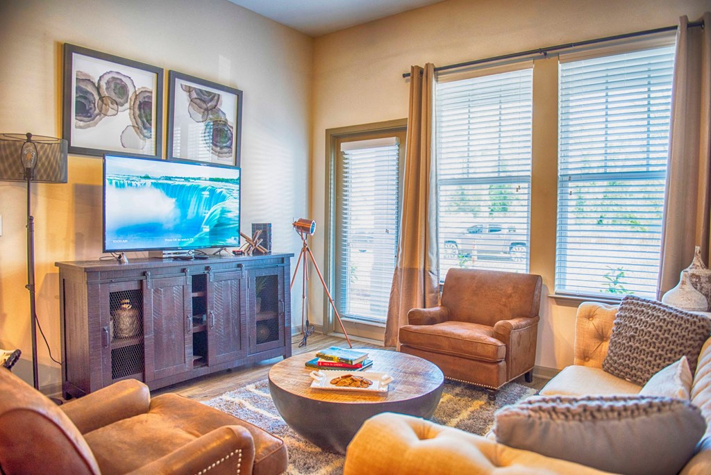 a living room with a couch and a tv