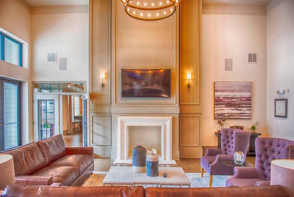 a living room with couches and a fireplace