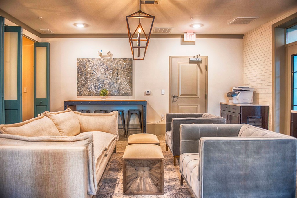 a living room with couches and a pool table