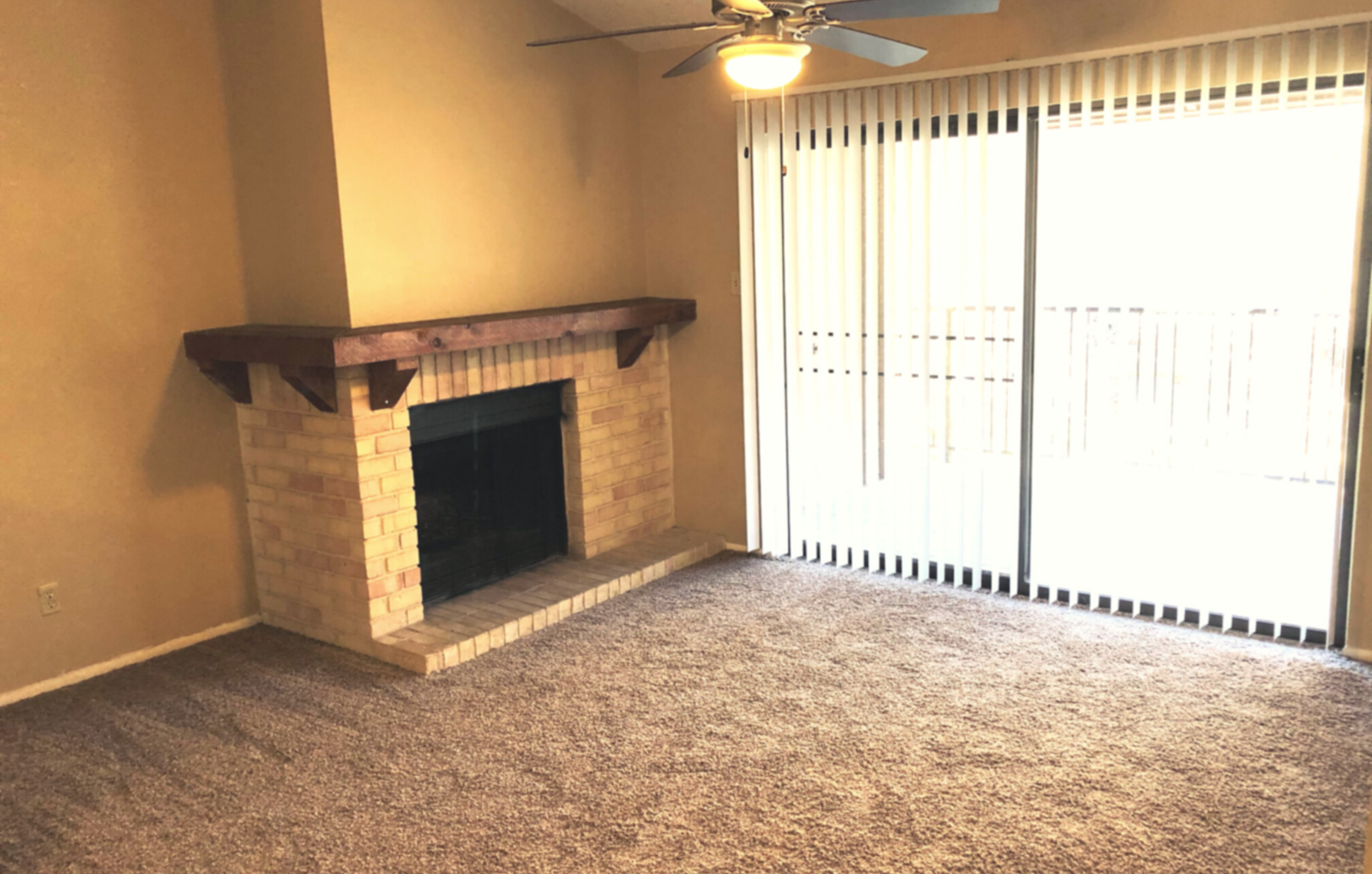 Fireplace in living room near large balcony