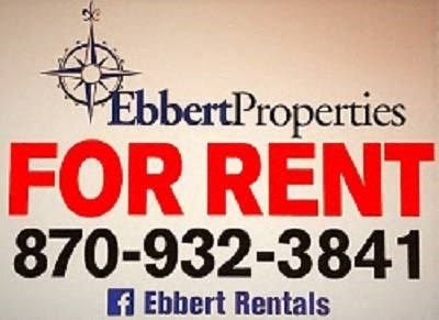 A sign advertising Ebert Properties for rent with a phone number and a Facebook page.