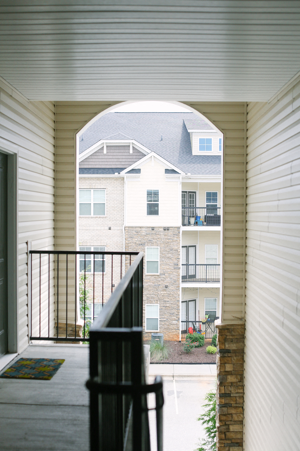 the view from the balcony of an apartment building with a balcony