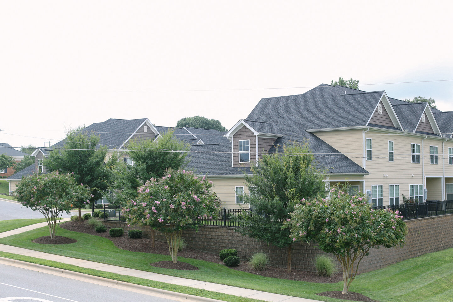a row of houses on the side of a street