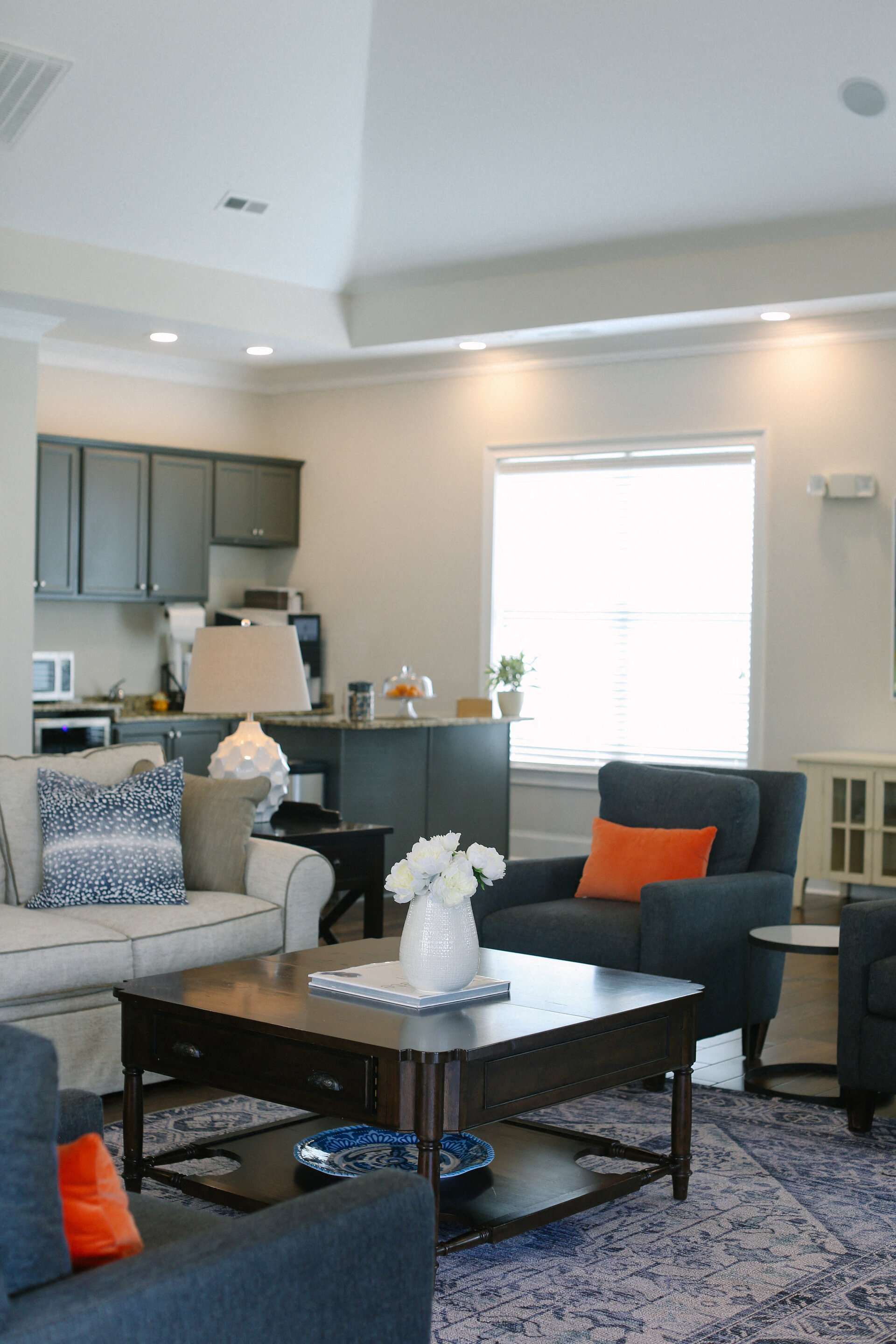 a living room with couches and chairs and a coffee table