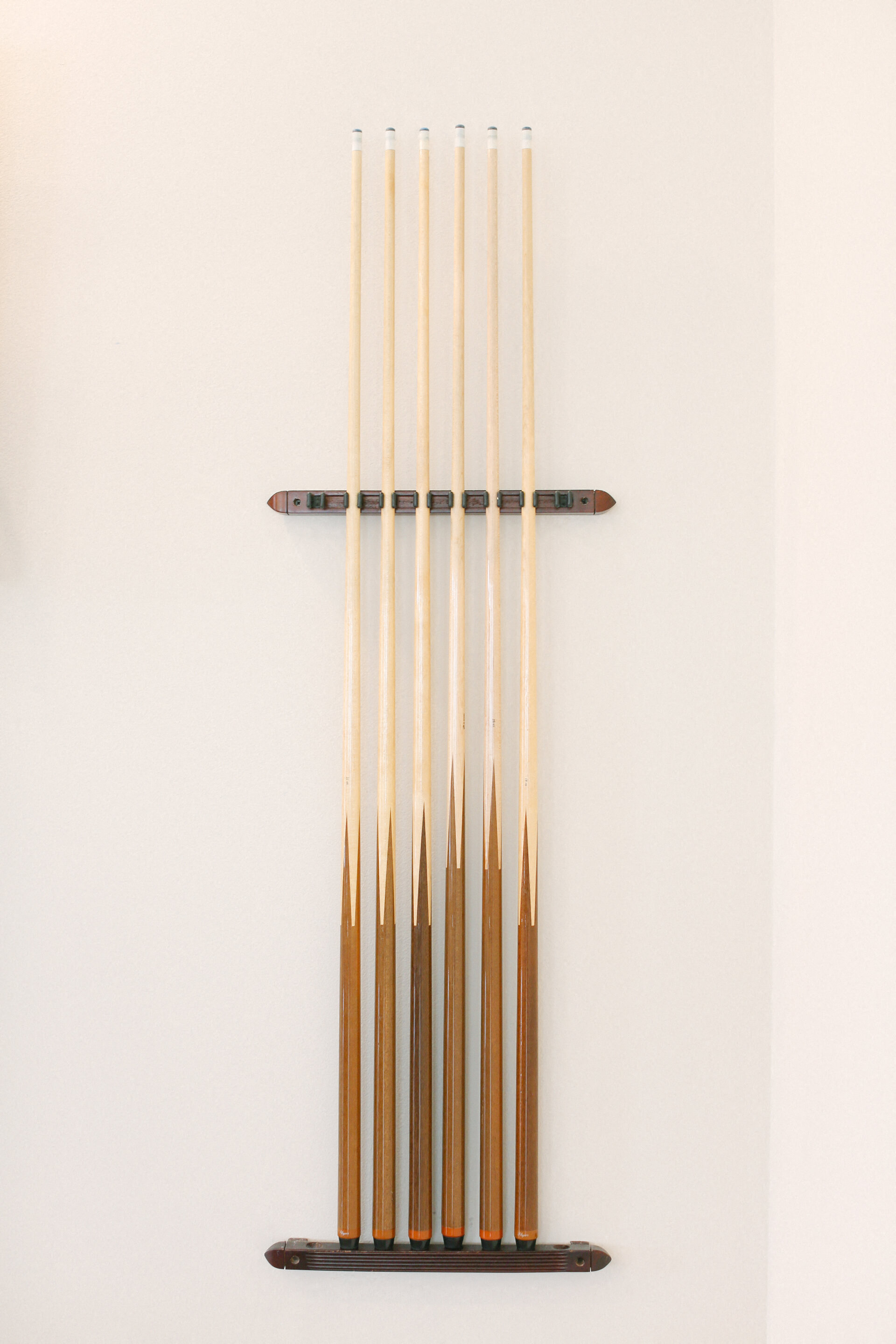 a group of wood acupuncture needles on a wall