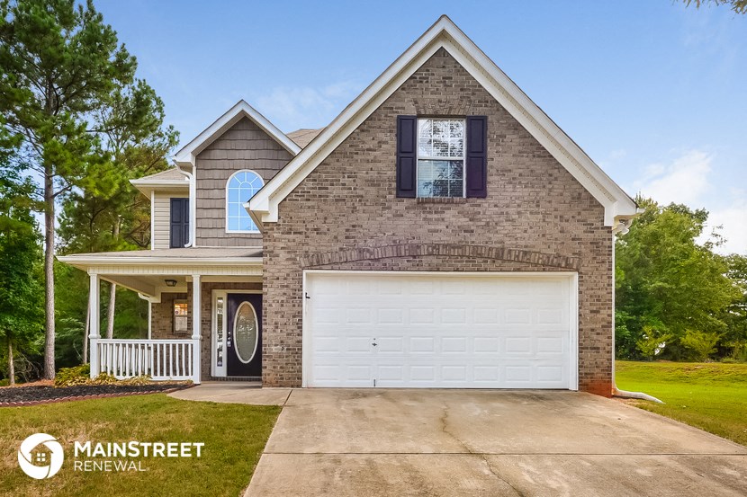 a brick house with a white garage door