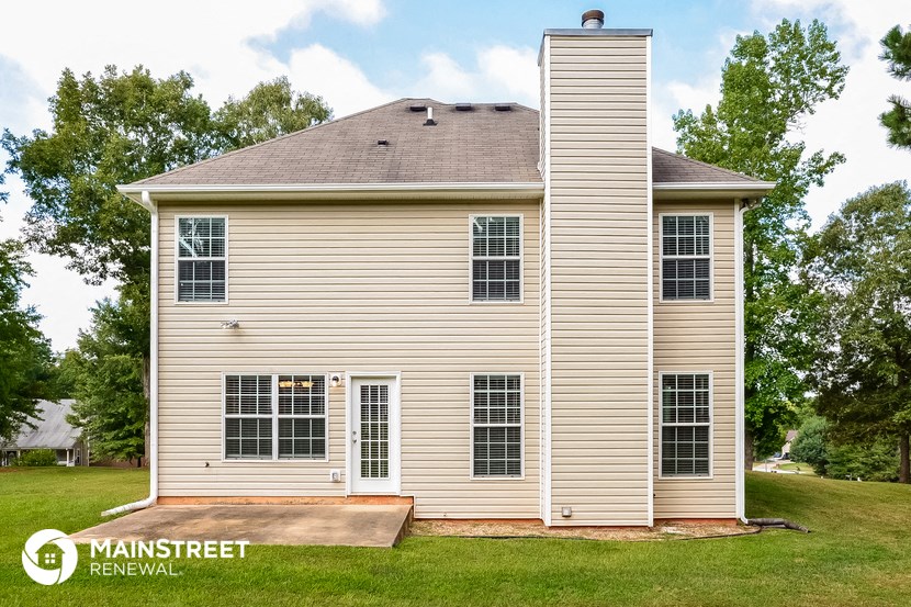 a small house with a ramp in front of it