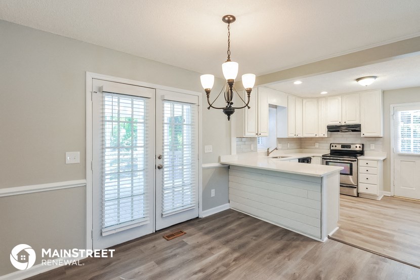 the kitchen is open to the dining room and living room