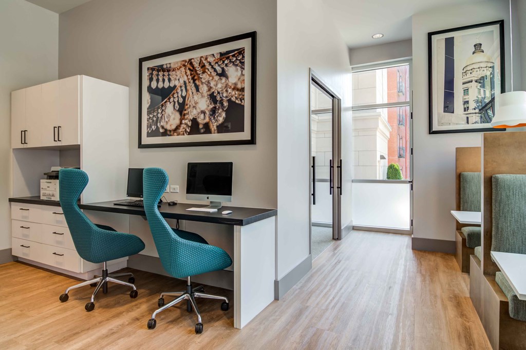 a home office with a desk and chair and a computer