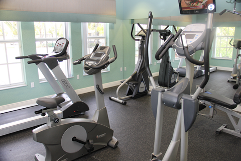 fitness center with bikes andtreadmills