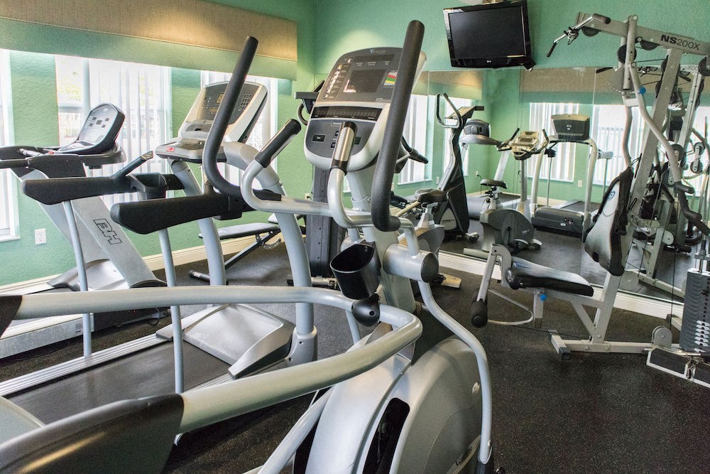 fitness center with cardio and weight equipment.