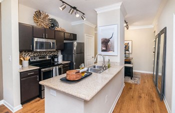 kitchen with stainless steel appliances in humble tx apartments