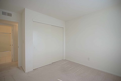 A white wall with a white door and a white wall with a white door.