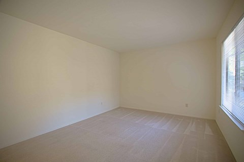 A room with a window on the right side.