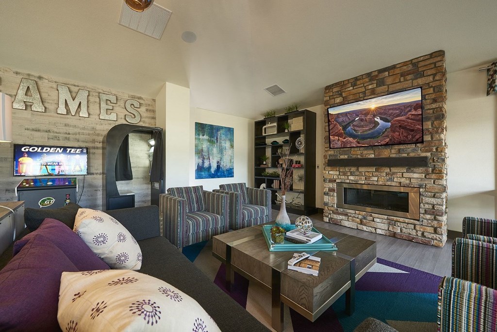 a living room with a fireplace and a television