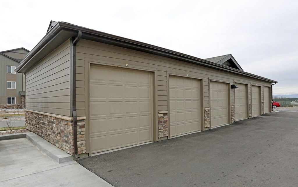 a row of garage doors on the side of a building