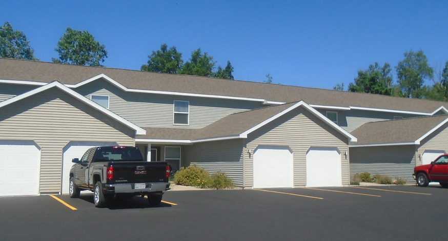 a house with a truck parked in a parking lot