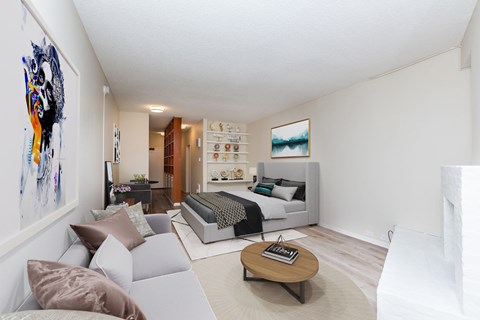 A living room with a grey couch and a coffee table.