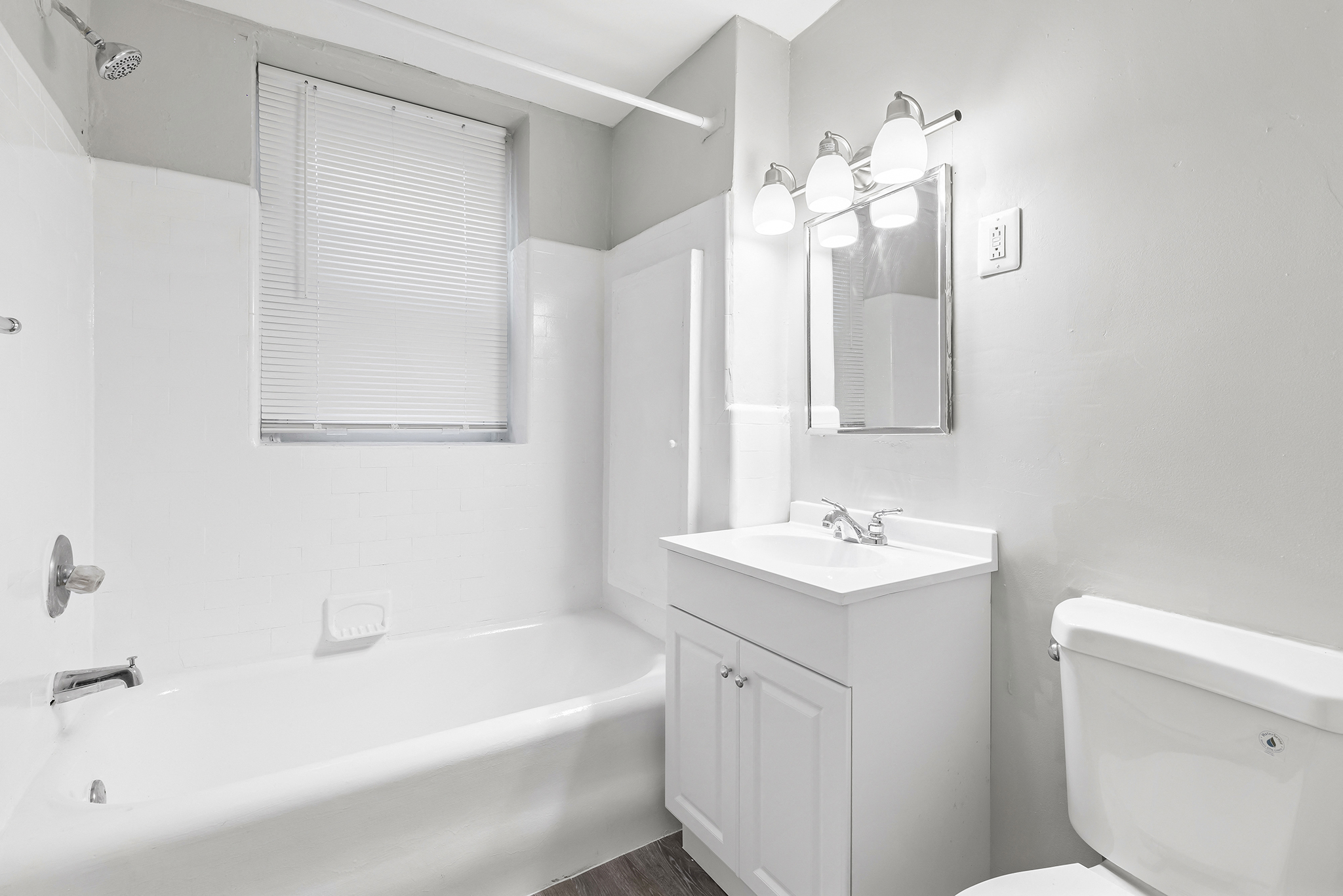 a bathroom with a sink toilet and a bath tub
