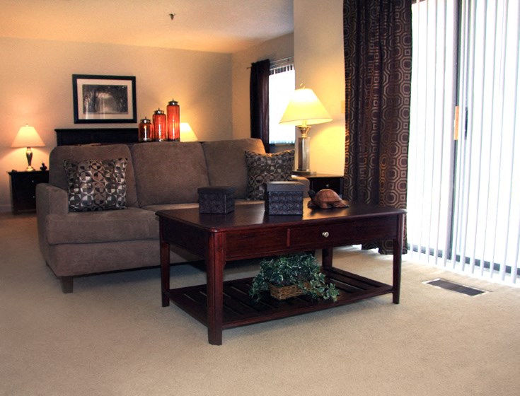 a living room with a couch and a table