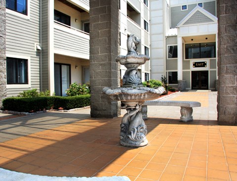 a fountain in front of a building