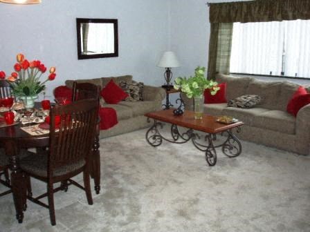 a living room with a table and a couch